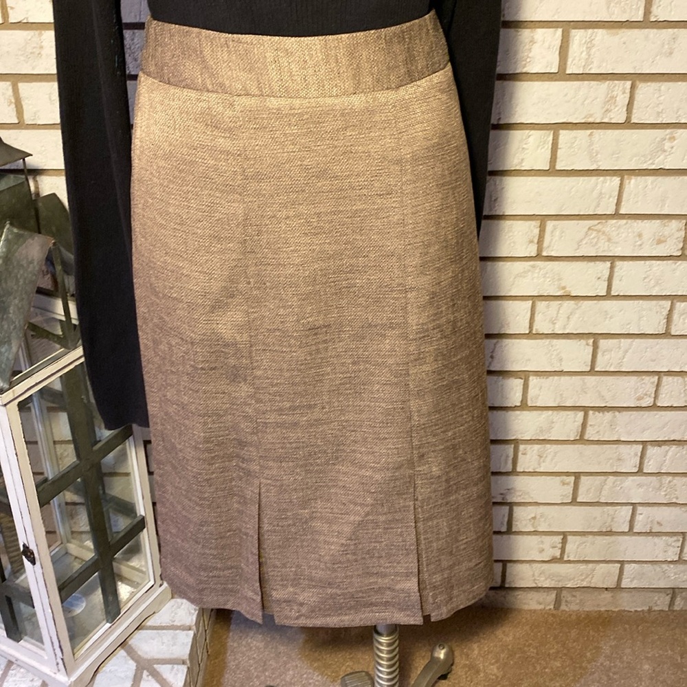 Covington / Tan skirt , two pleats in front, side zip
Size 16.  Never worn
